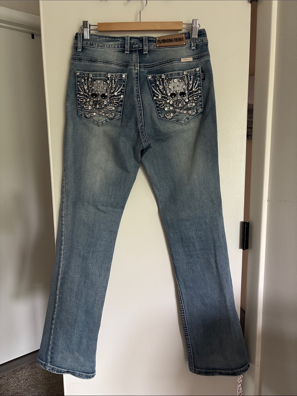 Flared Light Blue Jeweled Skull Back Pocket Jeans